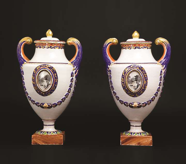 A pair of chinese export porcelain pistol-handled urns